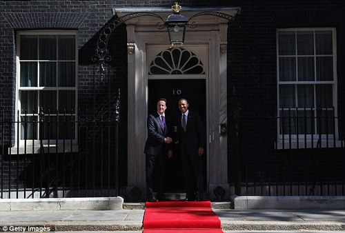 Cameron and Obama pose for the army of press photographers gathered outside 10 Downing Street